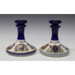 A pair of Wade British Navy Pusser's Rum ship's decanters and stoppers, height 22cm.Buyer’s