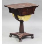 An early Victorian mahogany work table fitted with two drawers and a well, on a platform base and