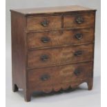 A George IV mahogany and stained pine chest of two short and three long drawers, on bracket feet,