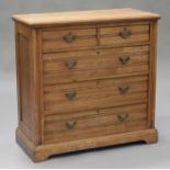 An Edwardian satin walnut chest of two short and three long drawers, height 101cm, width 103cm,