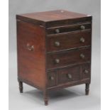 A George III mahogany gentleman's washstand, the hinged lid revealing a mirror and fitted interior