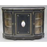 A late Victorian ebonized credenza with gilt metal mounts, the moulded breakfront top above a