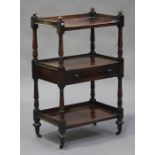 A mid-Victorian mahogany three-tier buffet of narrow form, fitted with a single drawer, raised on