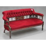 A late Victorian rosewood and foliate inlaid three piece tub back salon suite, comprising a settee