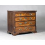 A George III mahogany bachelor's chest, the moulded top above a brushing slide, the two short and