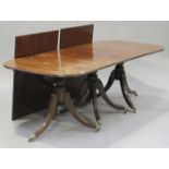 A 20th century Regency style mahogany triple pillar 'D' end dining table with two extra leaves,