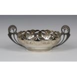 A WMF plated circular bowl, the rim decorated in relief and pierced with stylized plants and