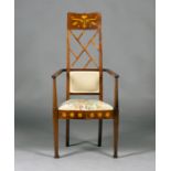 An Edwardian Arts and Crafts mahogany and foliate inlaid elbow chair, possibly by J.S. Henry, the