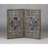 A pair of late Victorian Aesthetic period Arts and Crafts stained and leaded glass rectangular