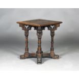 A late Victorian Gothic Revival oak square occasional table, in the manner of A.W.N. Pugin, the