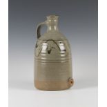 A Russell Collins, Hook Norton studio pottery flagon, the gently ribbed body covered in a green/grey