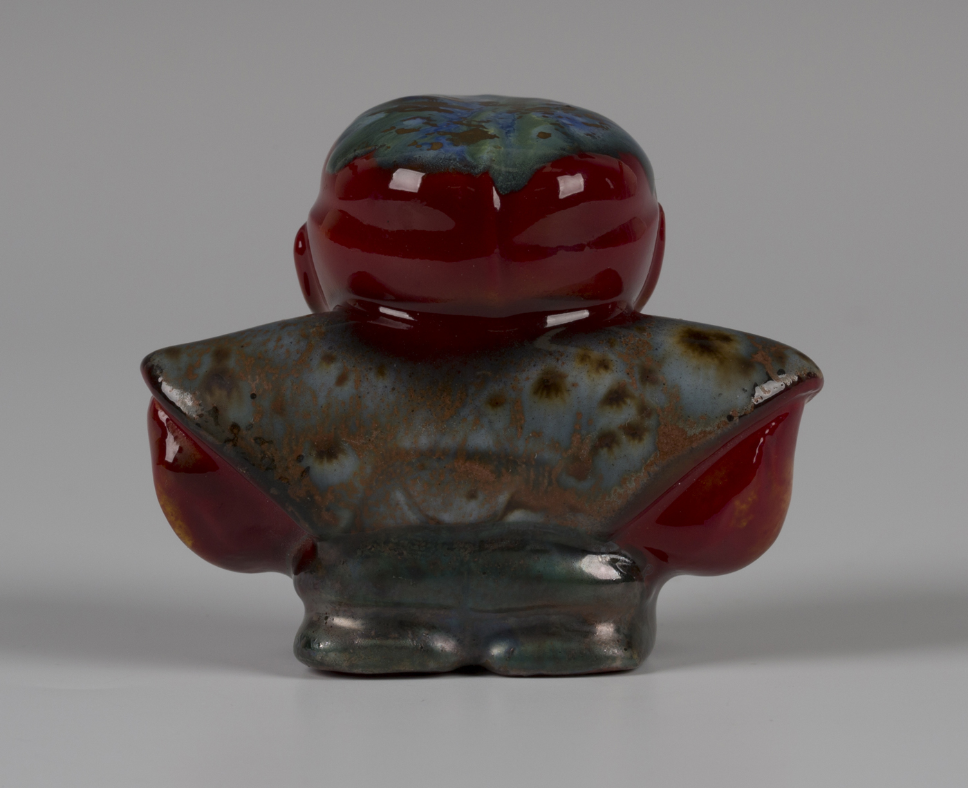 A Bernard Moore red flambé glazed figure of Diakokan, early 20th century, modelled as a squat - Image 3 of 3