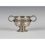 An Irish Arts and Crafts style silver two-handled cup, modelled in the manner of the Ardagh chalice,