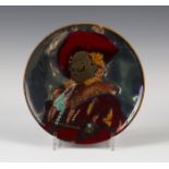 A Bernard Moore circular flambé glazed plate, circa 1904, decorated after Frans Hals' portrait of