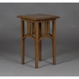 An Edwardian Arts and Crafts oak occasional table, in the manner of Liberty & Co, the square top