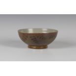 A Charles Vyse studio pottery bowl, the exterior decorated in oxides with fronds on a speckled brown