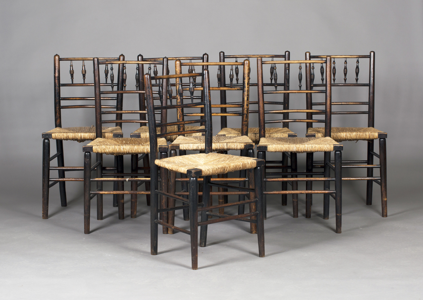 A matched set of eight late Victorian ebonized ash Sussex side chairs, probably by Morris & Co,