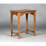An Edwardian Arts and Crafts walnut rectangular occasional table, bearing label marked 'Oetzmann &