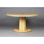 A late 20th century maple and ebony banded circular dining table by Guy Mallinson, raised on an