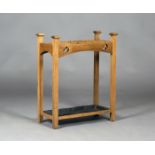 An Edwardian Arts and Crafts oak four-division stickstand, possibly by Goodyers of Regent Street,