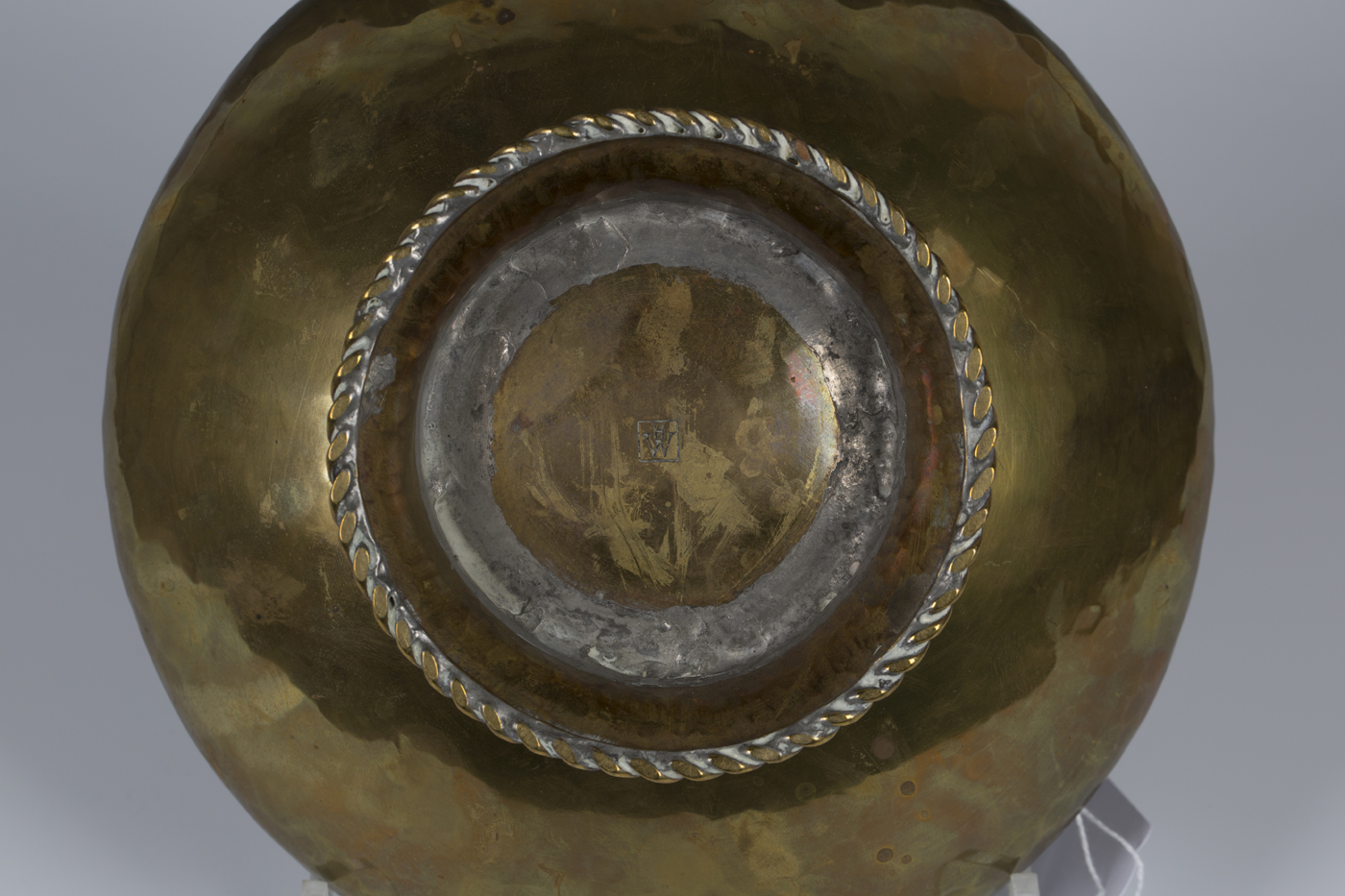 An Arts and Crafts brass circular bowl by Hugh Wallis with an overall hammered body, the spreading - Image 2 of 2