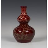 A Crown Ducal flambé glazed double gourd vase, circa 1920, by E.R. Wilkes, signed, decorated with