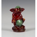 A Bernard Moore red flambé glazed model of Gazeka, early 20th century, modelled seated with green