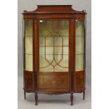 An Edwardian mahogany and foliate inlaid bowfront display cabinet, decorated with overall leaf
