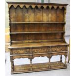 A moderen 18th century style oak dresser, the shelf back above three frieze drawers and open