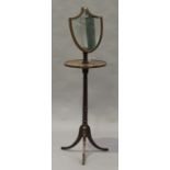 A 19th century mahogany and boxwood inlaid shaving stand, the adjustable shield shaped mirror