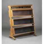 An early/mid-20th century softwood advertising shop display cabinet for 'Pyott's High Class