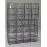 A mid-20th century galvanized wirework school locker, fitted with twenty-eight compartments,