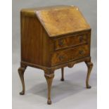 A 20th century walnut bureau, fitted with two drawers, on cabriole legs, height 104cm, width 80cm,