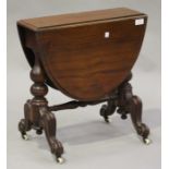 A 19th century mahogany baby Sutherland table, the oval top raised on turned supports and scroll