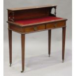 An Edwardian mahogany and line inlaid lady's writing table, the gallery back above two frieze