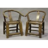 A pair of 20th century Chinese softwood horseshoe back armchairs, on block legs, height 86cm,