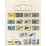 A collection of nine New Age stamp albums and a Windsor album, containing Great Britain and