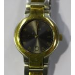 A Gucci steel and gilt lady's bracelet wristwatch, the signed metallic dial with gilt Arabic