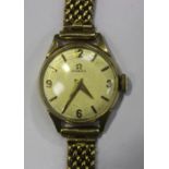 An Omega 9ct gold circular cased lady's bracelet wristwatch, the signed jewelled movement