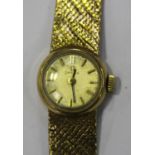 An Omega 9ct gold lady's bracelet wristwatch, the signed silvered dial with gilt baton hour markers,