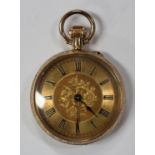 A 14ct gold cased keyless wind open-faced lady's fob watch with a gilt cylinder movement, gilt metal