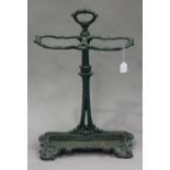 A late 19th century French green painted cast iron stick stand of foliate form, height 72cm.Buyer’