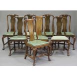 A set of eight early 20th century Queen Anne style walnut vase back dining chairs with drop-in