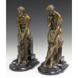 A pair of late 19th century French brown patinated cast bronze figures of classical maidens, each