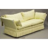 A modern Knole style settee, upholstered in foliate patterned cream damask, height 82cm, width