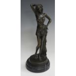 F. Rude - a late 20th century brown patinated cast bronze figure of a standing lady holding a drape,