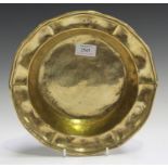 An 18th century Continental cast brass bowl, the raised sides with a shaped rim, diameter 26cm.