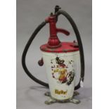 A Shell oil dispenser of tapering oval form by Baelz, fitted with a hose and winding handle,