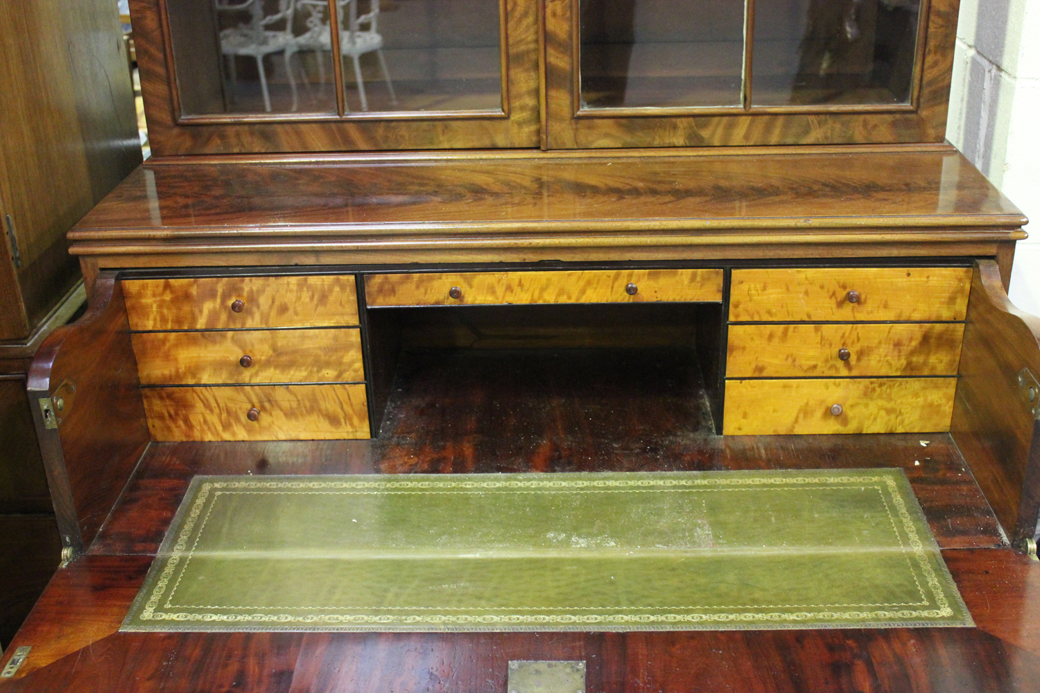 A William IV figured mahogany secrétaire bookcase cabinet, the moulded pediment above a pair of - Image 2 of 2