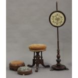 A Victorian walnut revolving piano stool, on carved tripod legs, a Victorian walnut polescreen, a